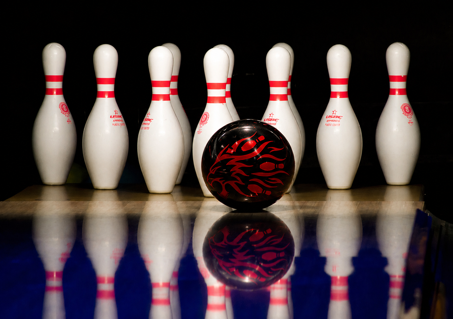 Bowling pins exploding after a solid pocket strike